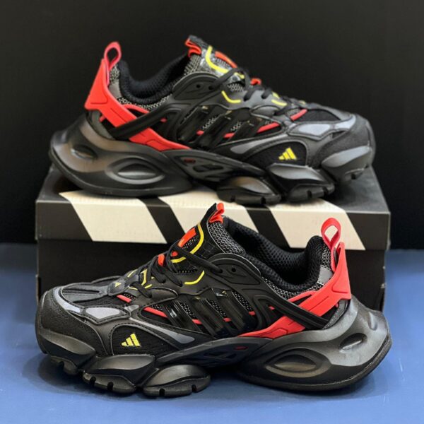آدیداس رانر اکس ال جی دیلاکس مشکی قرمز طلایی adidas XLG Runner Deluxe Black Gold Metallic Red