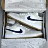 کفش نایک ایر جردن وان لو شیری تیک سرمه‌ای Nike Air Jordan 1 Low Cream Navy Swoosh