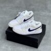 کفش نایک ایر جردن وان لو شیری تیک سرمه‌ای Nike Air Jordan 1 Low Cream Navy Swoosh